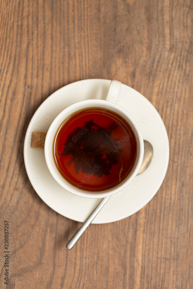 Top view of a cup of tea on wooden table Top view of a cup of tea on wooden table