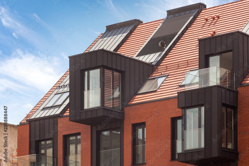 Contemporary Residential Building Exterior in the Daylight with modern balcony and brick facade Contemporary Residential Building Exterior in the Daylight with modern balcony and brick facade