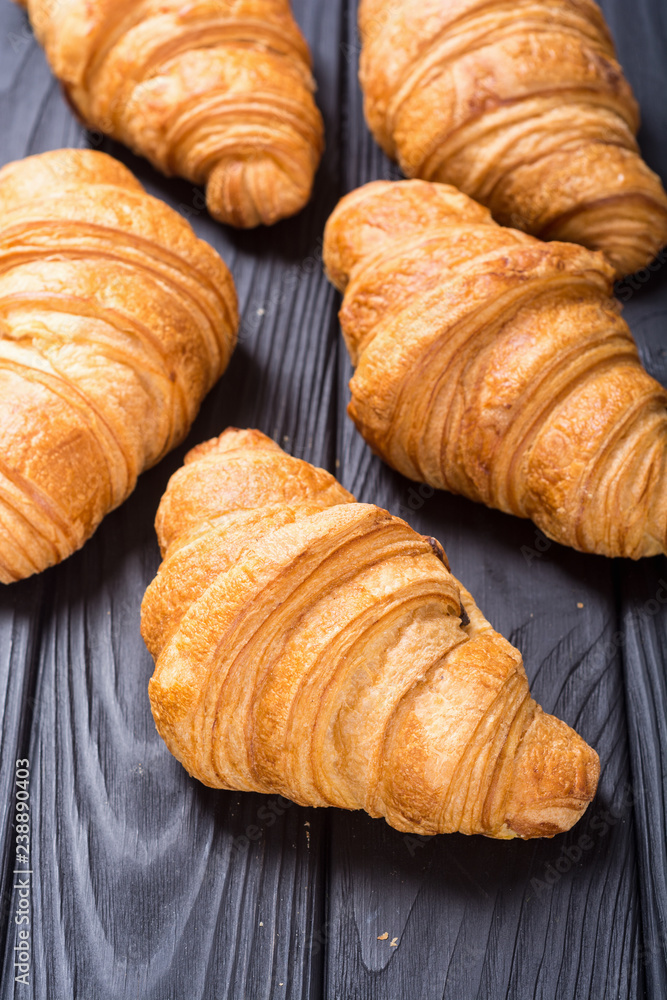 Croissants on wooden background Croissants on wooden background