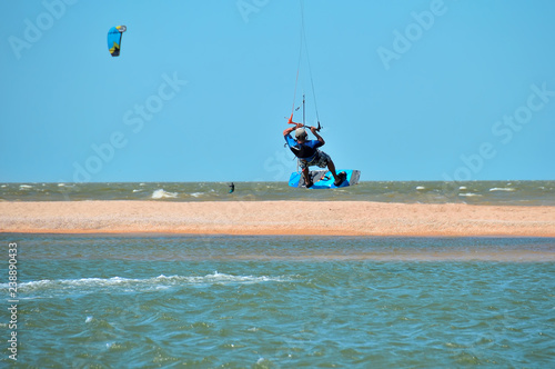 kitesurfing or kiteboarding, the athlete at the time of a jump above the surface of the water