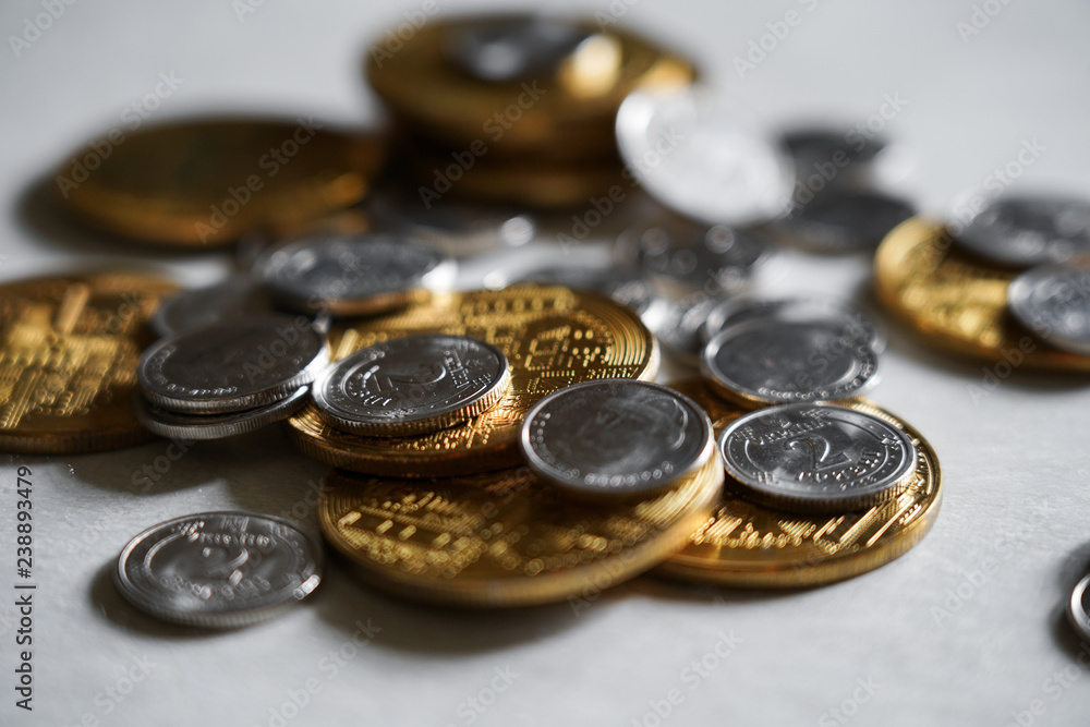 Macro shot detail of golden and silver color coin stacks on dark background with copy space for text. Business and finance growth, saving money, investment and interest concept. Macro shot detail of golden and silver color coin stacks on dark background with copy space for text. Business and finance growth, saving money, investment and interest concept.
