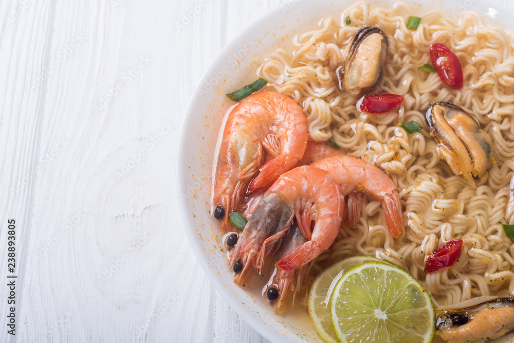 Instant noodles soup with shrimps and mssels . Asian food Instant noodles soup with shrimps and mssels . Asian food