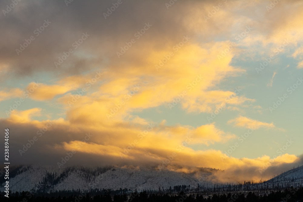 Fototapeta premium Sunset over the San Francisco Peaks mountain range in Flagstaff, Arizona, a popular ski, camp and hike location