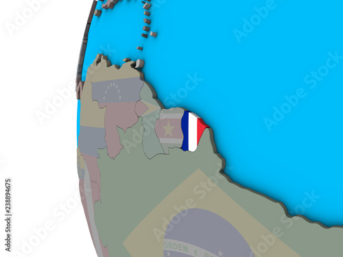 French Guiana with national flag on blue political 3D globe.