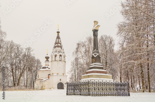 Monument to Prince Vasily Dmitrievich First on the background of the Assumption Cathedral in the city of Ples photo