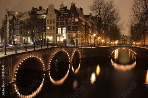 Amsterdam covered in snow at night