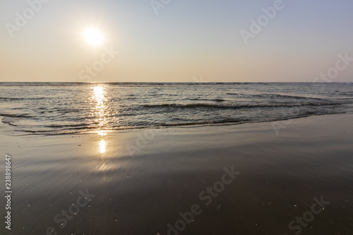 Sunset on Mandrem beach in Goa, India. photo