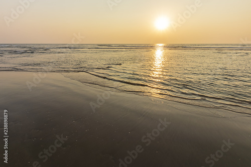 Sunset on Mandrem beach in Goa, India. photo