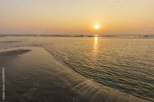 Sunset on Mandrem beach in Goa, India. photo