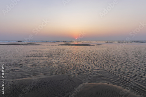 Sunset on Mandrem beach in Goa, India. photo