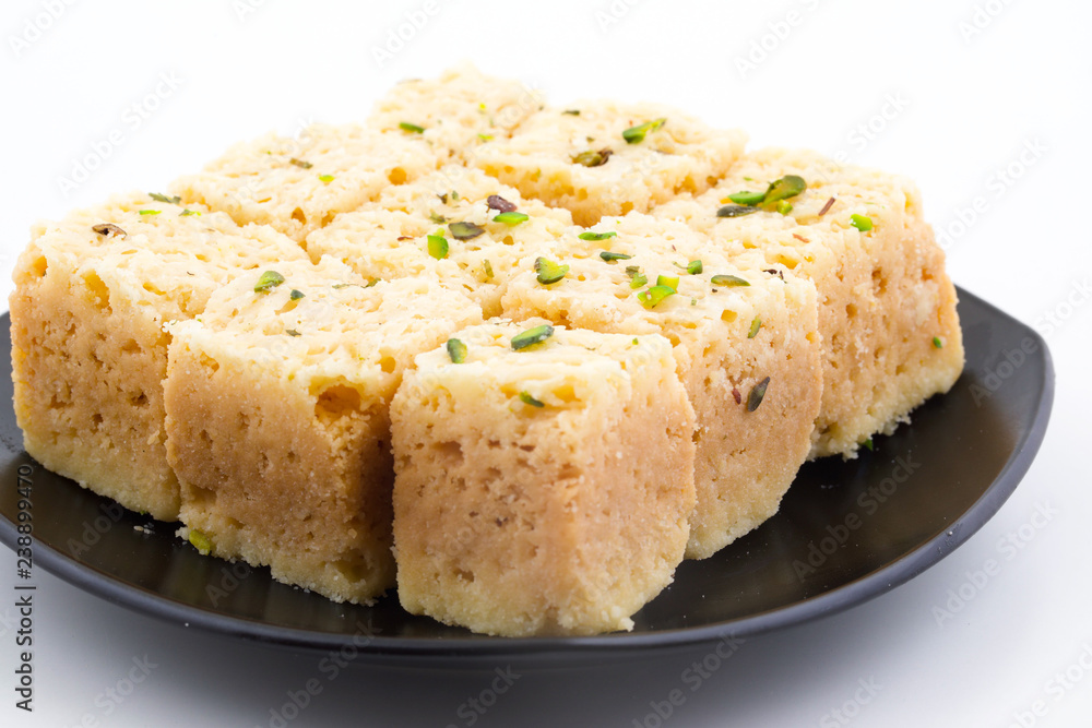 Indian Traditional Famous Sweet Food Mysore Pak or Mysoor Pak Isolated on White Background Indian Traditional Famous Sweet Food Mysore Pak or Mysoor Pak Isolated on White Background