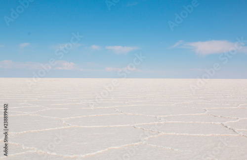 Uyuni Salar in Bolivia. Blue Sky and white salt ground.