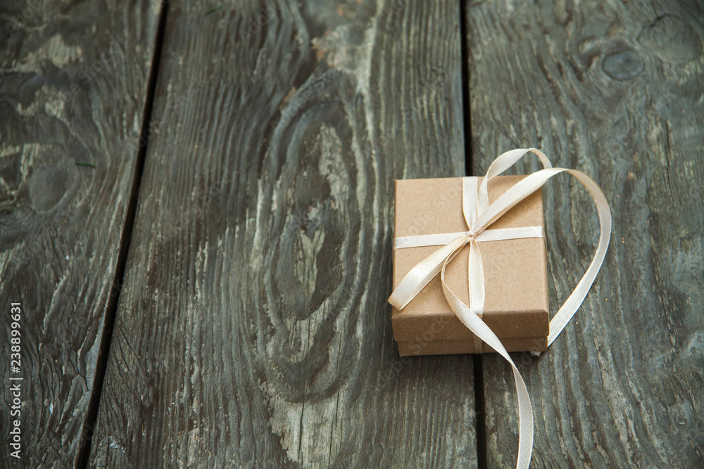 Christmas gift boxes on a rustic wooden background Christmas gift boxes on a rustic wooden background