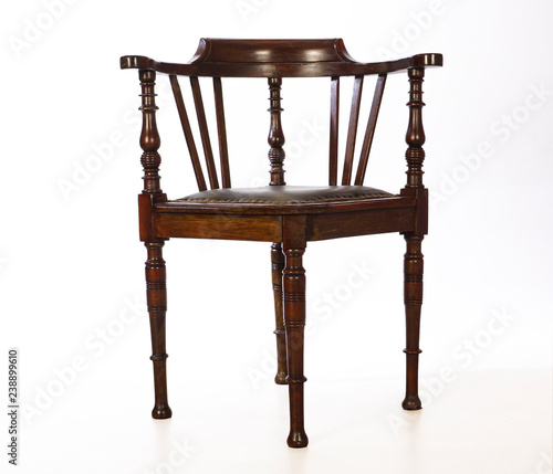 Wooden, old-fashioned corner chair. Isolated.