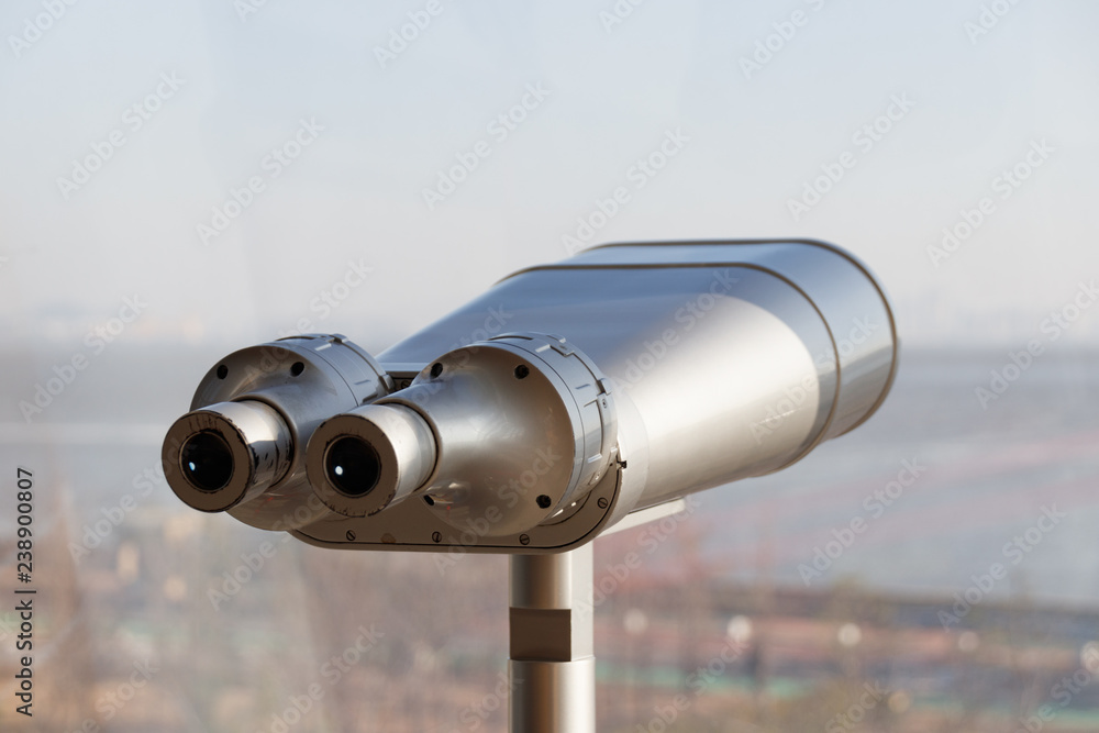 Tourist binoculars. Binoculars telescope on observation deck for tourist.