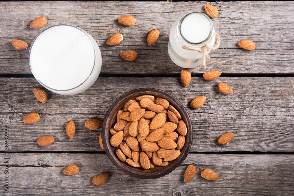 Almond milk on wooden table Almond milk on wooden table