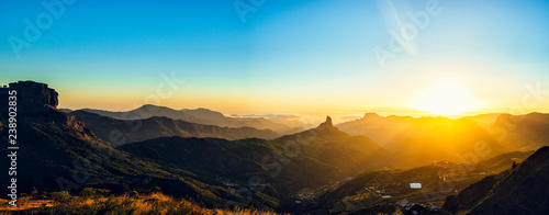 Spain, Canary Islands, Gran Canaria, panoramic view of mountain landscape at sunset photo