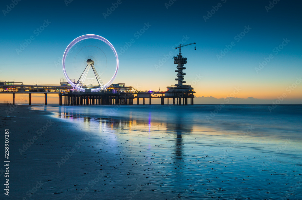 ferris wheel on the Pier at Scheveningen at sunset