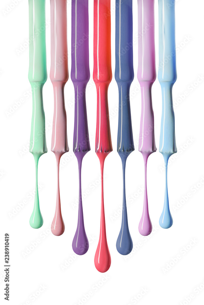 bright dripping nail polish on brushes with variation of colors isolated on white bright dripping nail polish on brushes with variation of colors isolated on white