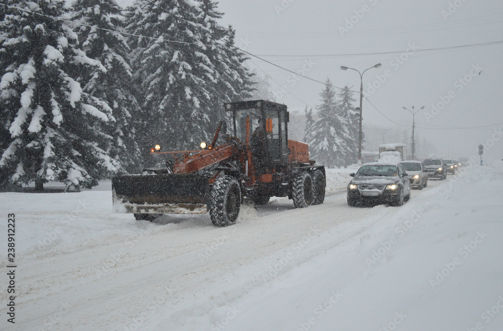 Cars in the city in a blizzard Cars in the city in a blizzard