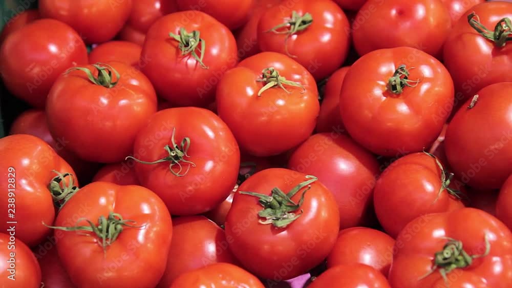 Many perfect tomatoes on vegetable market stall Many perfect tomatoes on vegetable market stall
