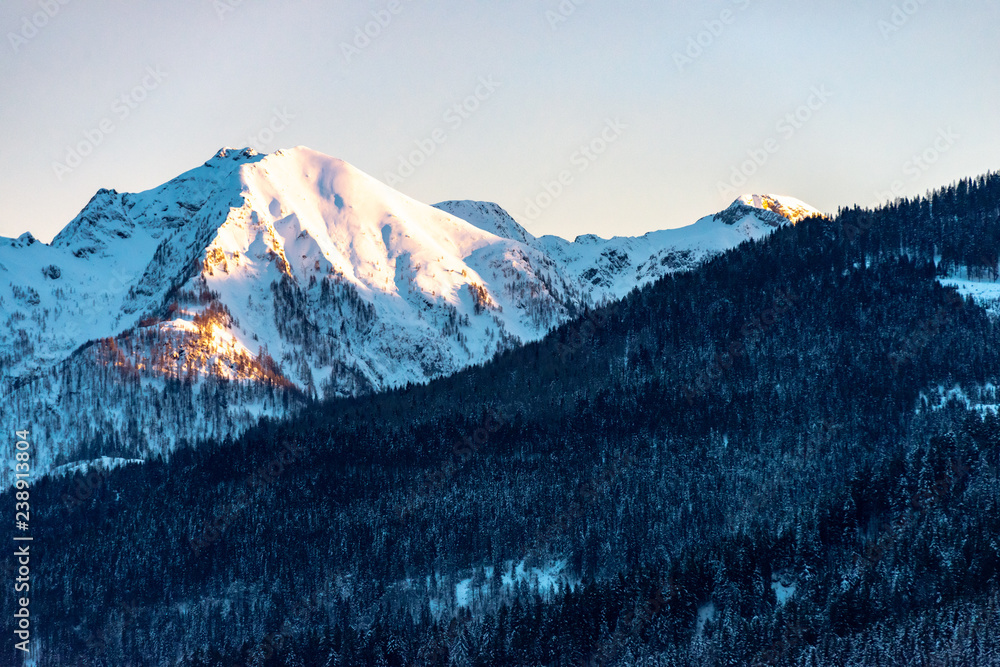 alps mountain peak in early morning light