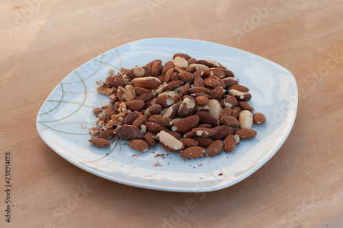 paranuts and almonds on plate photo