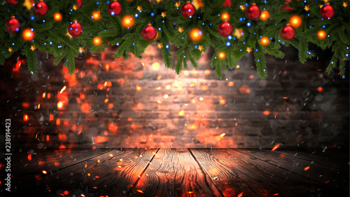 Christmas tree garland on the background of an old brick empty wall. Christmas balls on the garland. Sparks, neon spotlight, illuminated Christmas