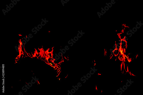 Fire flames on Abstract black background, Burning red hot sparks rise from large fire in, Fiery orange glowing