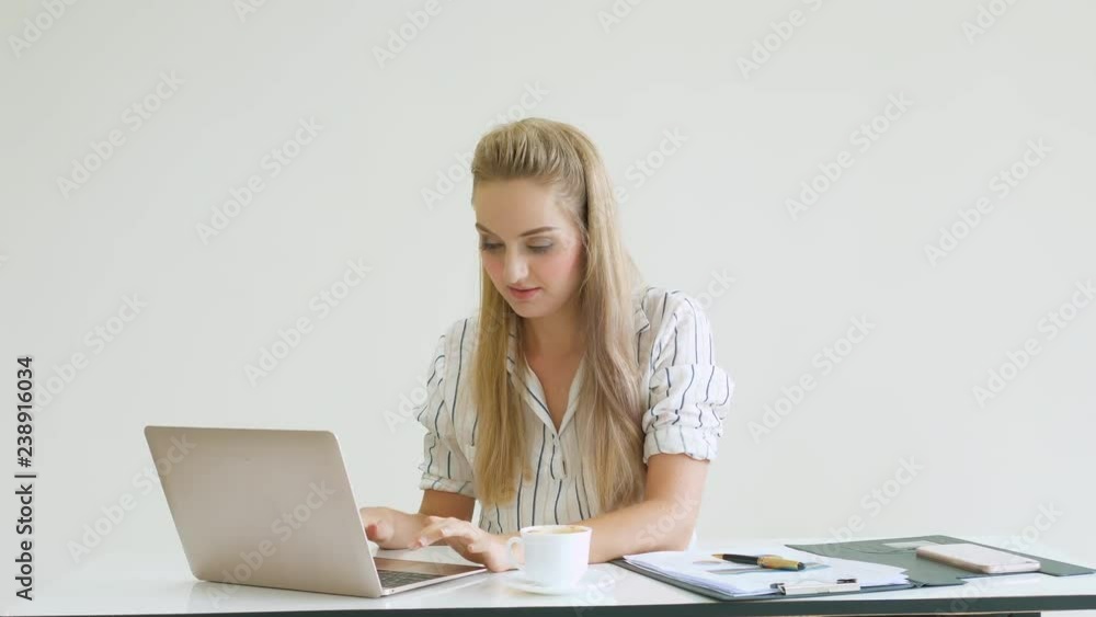 Women work with a laptop computer at office Women work with a laptop computer at office