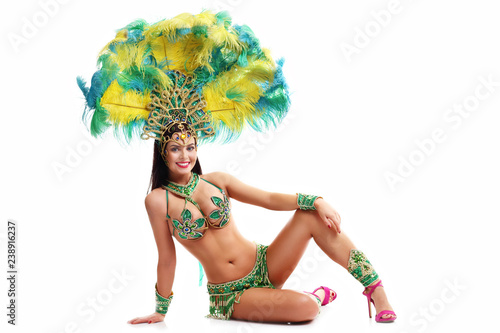 Brazilian woman posing in samba costume over white background photo