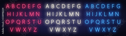 Neon alphabet on brick wall background. Vector illustration of the EPS 10.