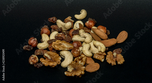 Heap of many kind of nuts with black background isolated