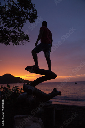man watching sunset at costa rica beach