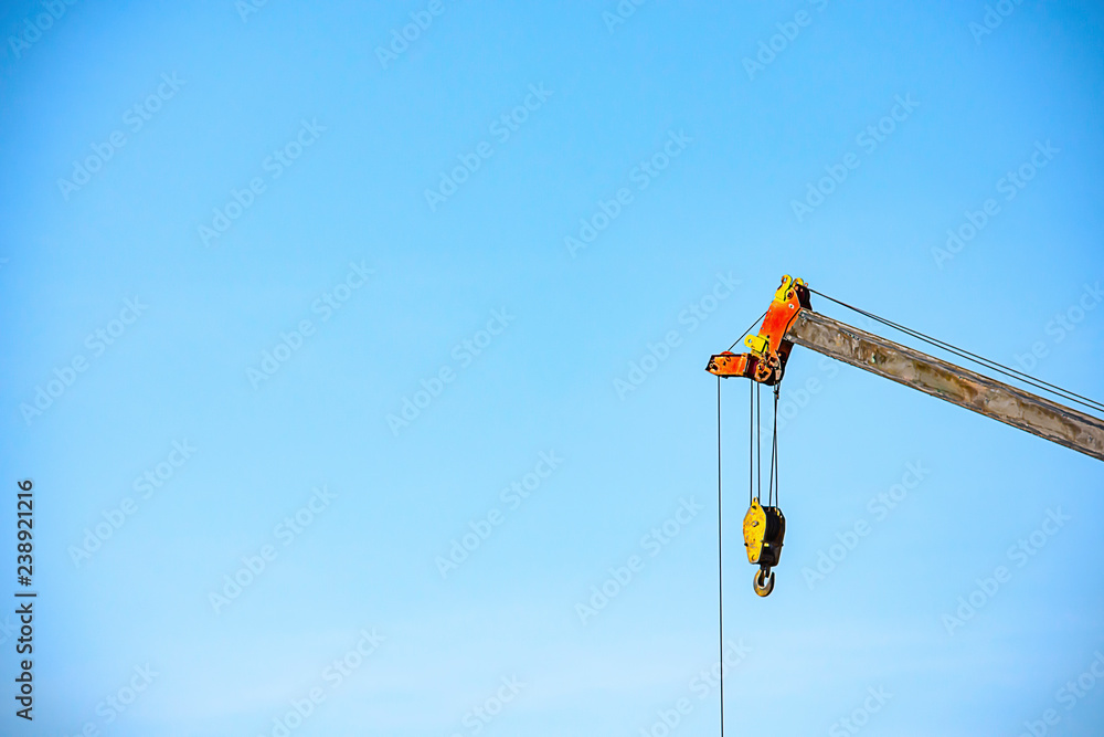 Sling and hoist the crane arm The background sky Sling and hoist the crane arm The background sky
