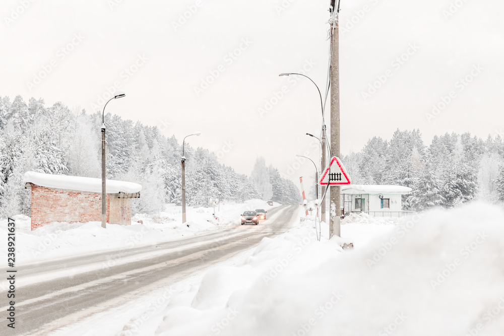 Perm, Russia - beautiful winter landscape with road and snow-covered trees Perm, Russia - beautiful winter landscape with road and snow-covered trees