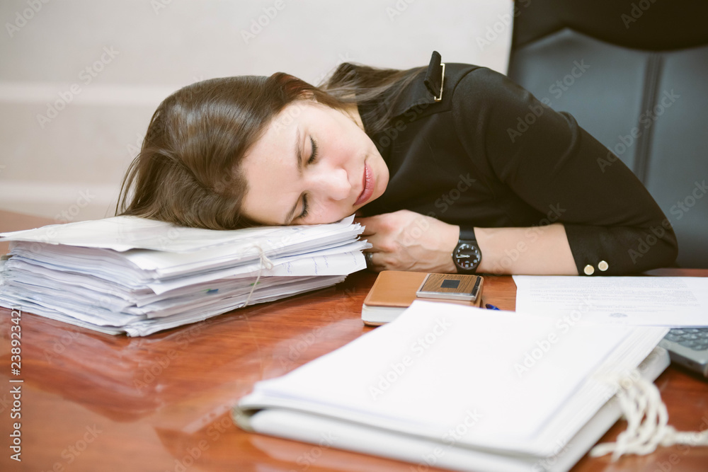 Business woman tired from working with laptop computer. Sleeping and taking nap concept. Business people and workload theme. Business woman tired from working with laptop computer. Sleeping and taking nap concept. Business people and workload theme.