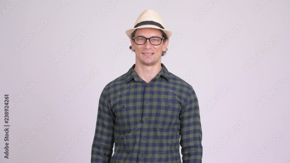Happy hipster man smiling with arms crossed Happy hipster man smiling with arms crossed