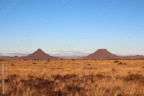 Two well known flat top mountains in the central Karoo called Koffiebus and Teebus, South Africa. photo