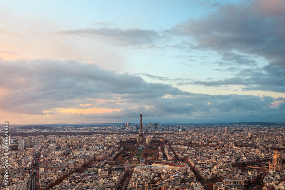 aerial view of the city of paris and the eiffel tower at sunset in france