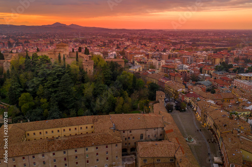 Sunset aerial panorama of Cesena in Emilia Romagna Italy near Forli and Rimini, with the medieval Malatestiana castle, Piazza del Popolo and Roman Catholic churches and cathedral on a winter afternoon photo