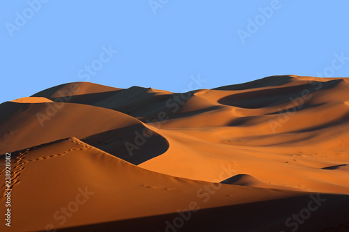 Moroccan Sahara sand dunes and shadows at sunset