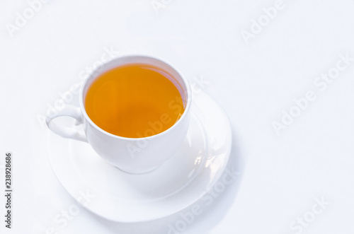 Wallpaper Mural Orange herbal flavored christmas tea with cinnamon and cardamom honey white cup on a white wooden table Torontodigital.ca