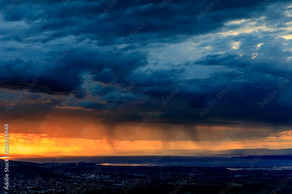 Rain at Sunset over Lake Constance and City