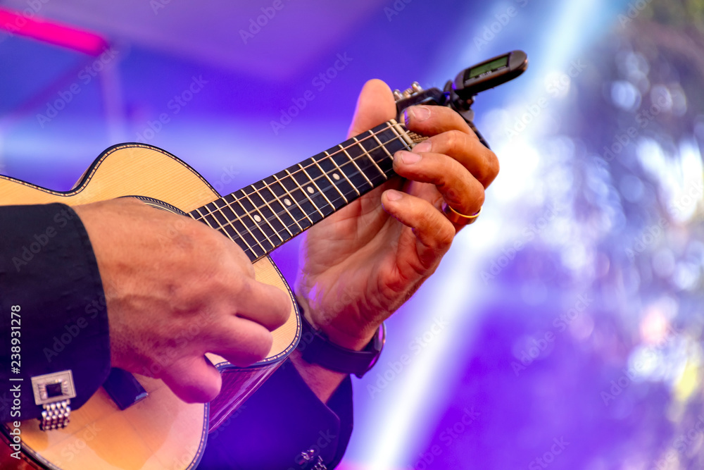 Fototapeta premium Live musical performance of Brazilian popular music called chorinho with little acoustic guitar with four strings