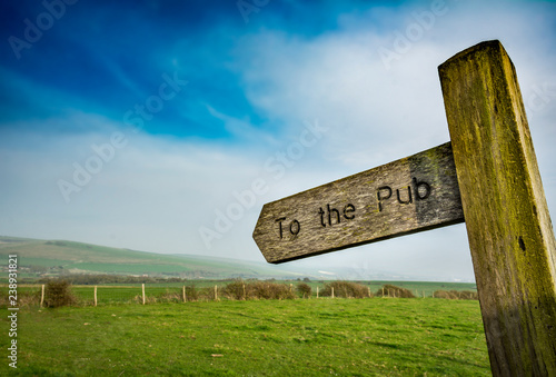 Canvas Print To the pub sign in rural setting