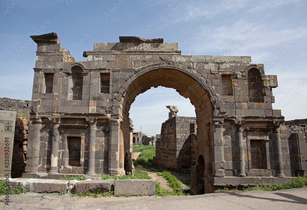 The entry arch of the ancient city of Busra (Bosra). Syria