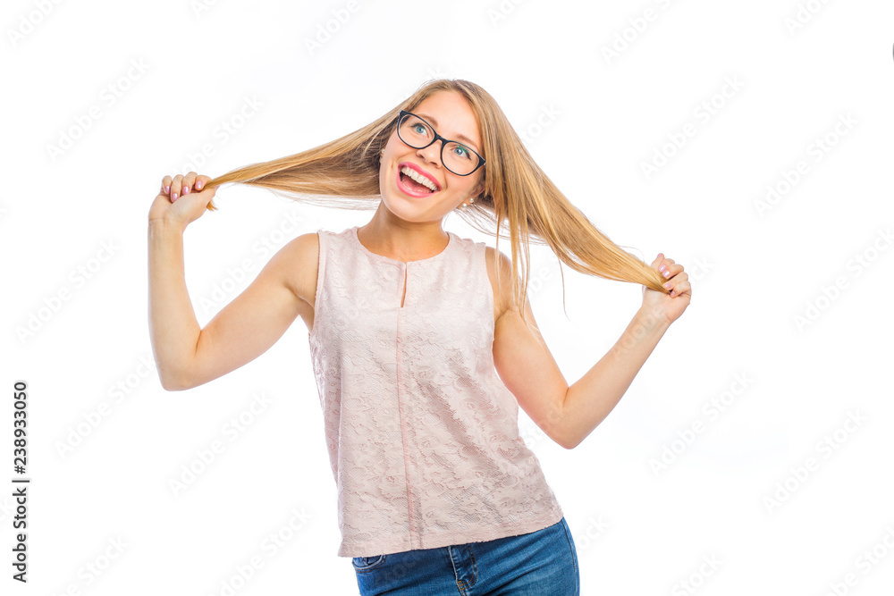 Cute young blond woman in glasses with a smile on her face holds her hair with both hands with her hands apart, emotions of a woman filming on an isolated background Cute young blond woman in glasses with a smile on her face holds her hair with both hands with her hands apart, emotions of a woman filming on an isolated background