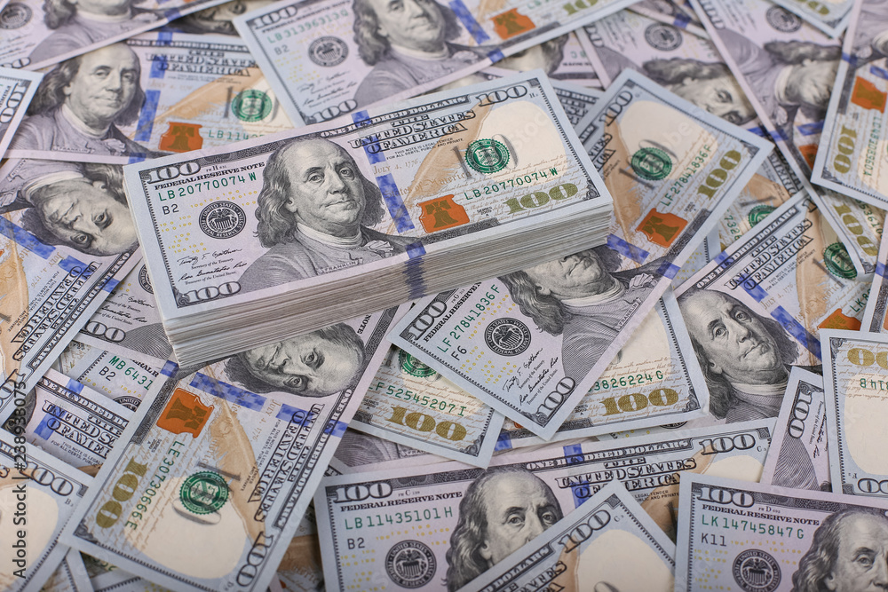 American dollars in one hundred banknotes. Lot of dollars close up American dollars in one hundred banknotes. Lot of dollars close up