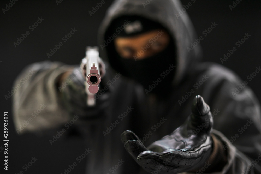 custom made wallpaper toronto digitalRobber with a gun robbing intimidate.Crime and robbery concept.